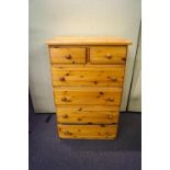 A pine chest of drawers