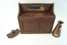 A small mahogany wall cabinet,