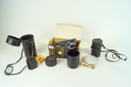 A collection of vintage camera lenses to include Pentax lenses and a Sigma telephoto 300mm in box