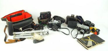 A collection of assorted cameras and accessories to include AIDIS and Pentax