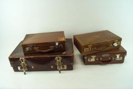 Three attache cases and a suitcase