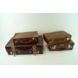 Three attache cases and a suitcase