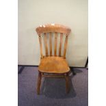 An early 20th century elm farmhouse side chair with rail back,