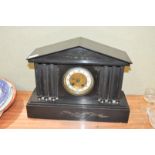 A black slate pediment clock