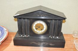 A black slate pediment clock