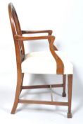 A George III style mahogany elbow chair with pierced splat, stuff over seat,