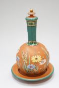 A redware bottle vase, cover and stand,