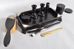 An early 20th century ebony part dressing table set some with silver mounts,