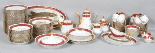 A French porcelain part dinner service, early 20th century, printed gilt marks,