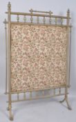 An Edwardian brass rectangular fire screen with pierced baluster gallery,