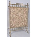 An Edwardian brass rectangular fire screen with pierced baluster gallery,