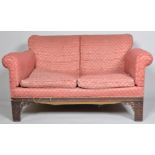 A mahogany two seat sofa, with Chippendale style blind fretwork legs and frame,
