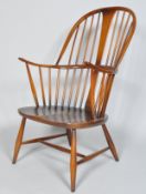 An Ercol dark Windsor armchair, model 514, 1960's,