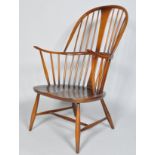 An Ercol dark Windsor armchair, model 514, 1960's,