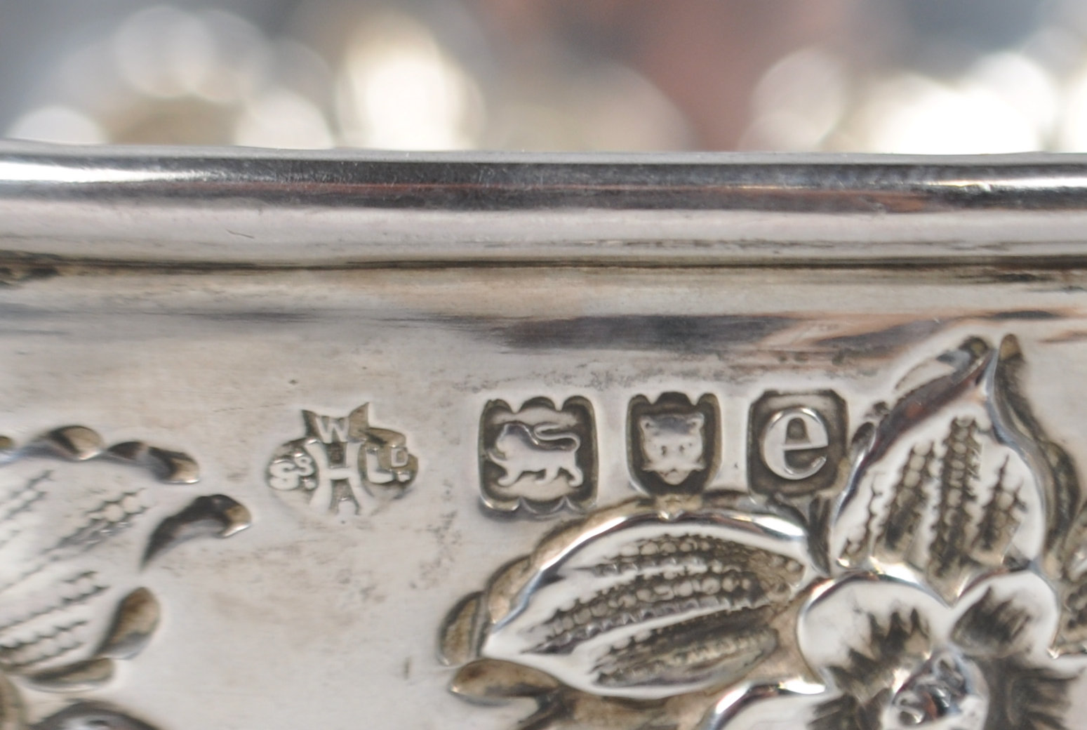 A silver hemispherical bowl decorated with repousse rococo panels and raised on a plain foot - Image 2 of 2