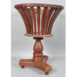 A mahogany jardiniere of open basket form with gadrooned edge,