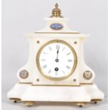 A late 19th century French alabaster mantel clock of cantered rectangular form,