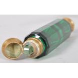 A late 19th century double ended green glass smelling salts and perfume bottle,