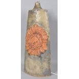 A Bernard Rooke Studio pottery table lamp base, decorated in relief with a flaming sun,