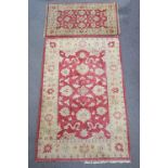 A Turkish style carpet and a matching rug,