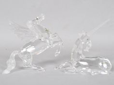 A Swarovski crystal figure of a unicorn 11cm high and a similar figure of Pegasus, 12cm high,