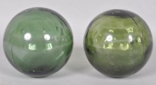 Two green glass fishing floats,