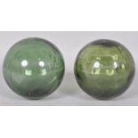 Two green glass fishing floats,