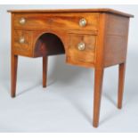 A Regency mahogany kneehole desk, circa 1820, with ebony string inlay and plate glass top,