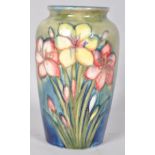 A Moorcroft pottery Lily pattern tube lined vase, impressed marks and signature to the base,