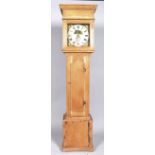 An early 19th century pine longcase clock,