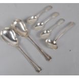 A pair of silver Art Deco style salad servers with lobed bowls and decorated handles