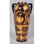 An early 20th century pottery two handled Art Nouveau style slipware 'Scrafitto' vase,