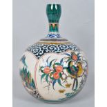 An Asian pottery onion vase, polychrome decorated with birds in a fruit tree and other vignettes,