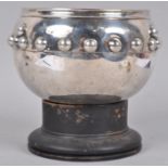 A large scale silver Glastonbury bowl of round form, applied with a band of hemispheres