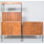 A Vansons teak 1960's chest of three long dawers on black tubular feet, applied with black label,