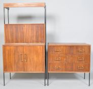 A Vansons teak 1960's chest of three long dawers on black tubular feet, applied with black label,