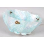 A 1920's opaque glass ceiling light shade, decorated in tones of blue and green,