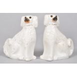 A pair of late 19th century Staffordshire dogs, set with glass eyes,