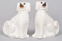 A pair of late 19th century Staffordshire dogs, set with glass eyes,