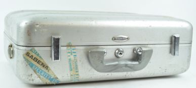 A Halliburton aluminium case with applied security labels, 14cm high,