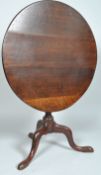 A 19th century George II oak tilt top table on baluster stem with three cabriole legs