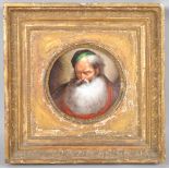 A 19th century circular porcelain plaque painted in enamels with a bearded elderly gentleman,