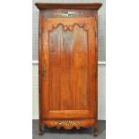 A 19th century French fruitwood armoire,