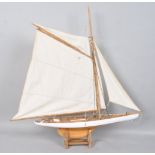 A 1950's gaff rigged pond yacht, on stand,