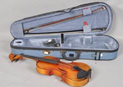 A 60cm Carlo Giardino violin with two piece back, comes with two bows,