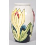 A small Moorcroft pattern tube lined vase,