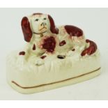 A 19th century Staffordshire inkwell, modelled as a spaniel,