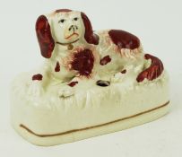 A 19th century Staffordshire inkwell, modelled as a spaniel,