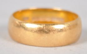 A yellow metal 6.0mm D shape wedding ring. Hallmarked 22ct gold, Birmingham, 1960.