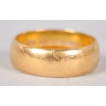 A yellow metal 6.0mm D shape wedding ring. Hallmarked 22ct gold, Birmingham, 1960.